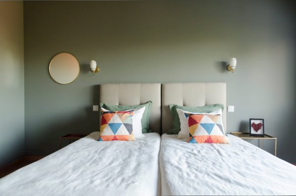 eca-agora-guest-house-vila-do-conde-the-egypt-room-2-individual-beds-sofa-bed-bathroom-with-meating-area-slider-1