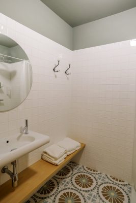 eca-agora-guest-house-vila-do-conde-the-egypt-room-2-individual-beds-sofa-bed-bathroom-with-meating-area-slider-5