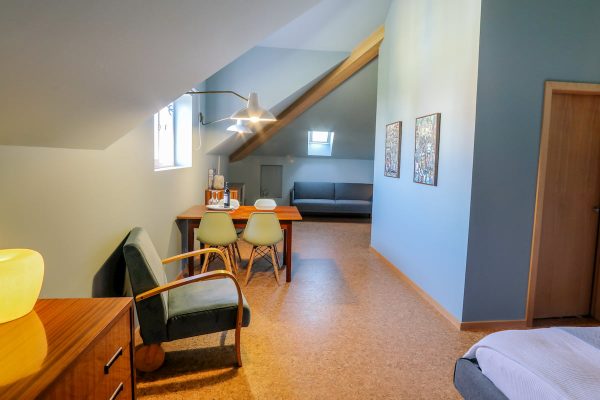 eca-agora-guest-house-vila-do-conde-the-maias-room-king-sized-bed-sofa-bed-bathroom-with-meating-area-slider-7