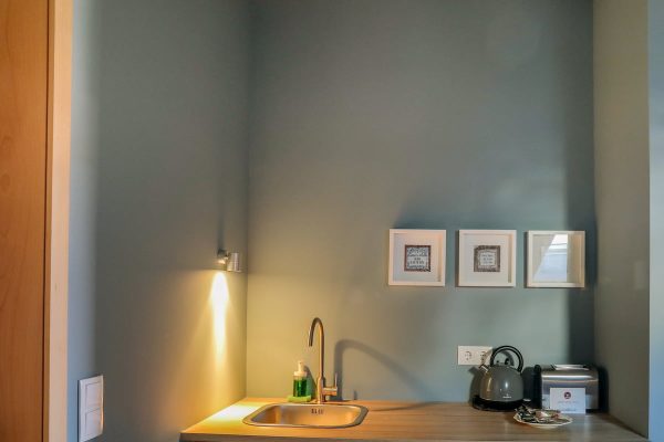 eca-agora-guest-house-vila-do-conde-the-maias-room-king-sized-bed-sofa-bed-bathroom-with-meating-area-slider-9
