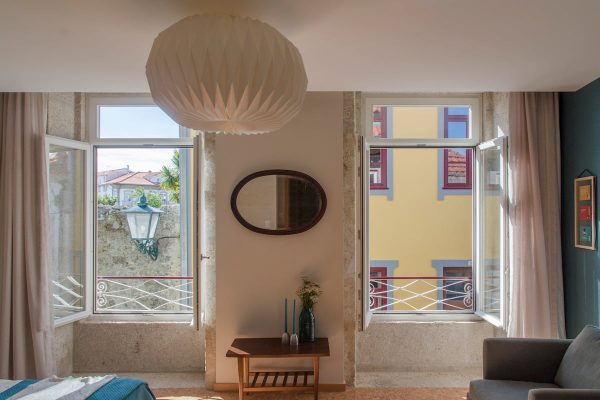 eca-agora-guest-house-vila-do-conde-the-mandarim-room-king-sized-bed-bathroom-with-meating-area-slider-3