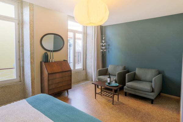 eca-agora-guest-house-vila-do-conde-the-mandarim-room-king-sized-bed-bathroom-with-meating-area-slider-5