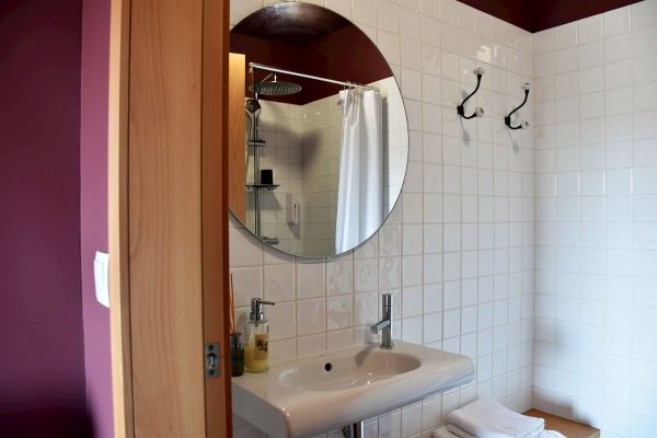 eca-agora-guest-house-vila-do-conde-the-relic-room-king-sized-bed-bathroom-small-meating-area-slider-8